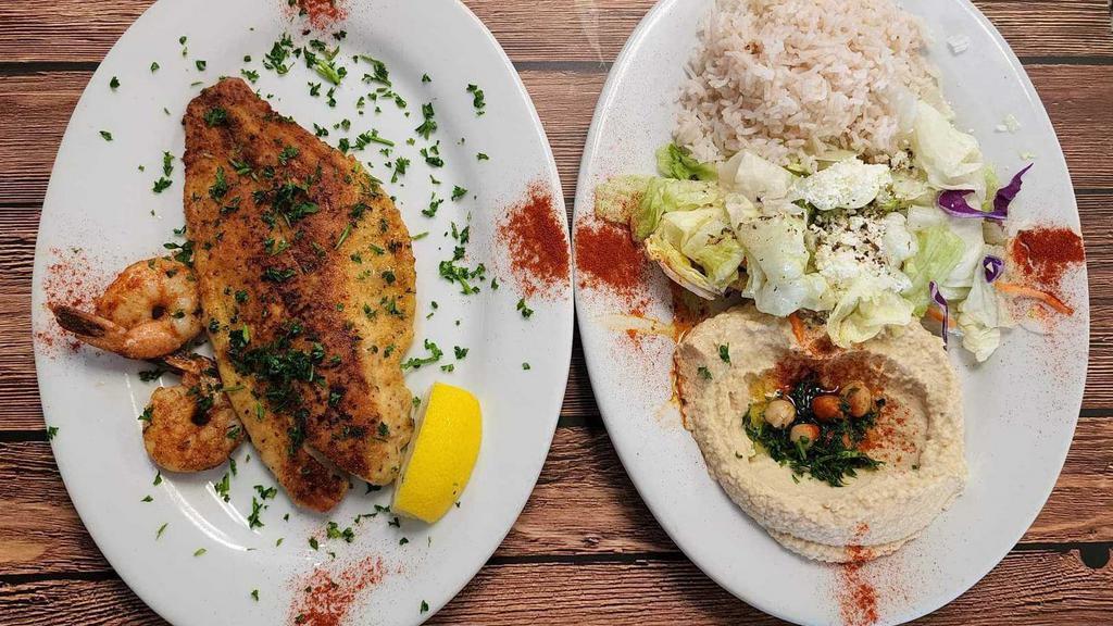 Grilled Redfish & Shrimp · Redfish & shrimp, grilled with our in-house seafood spices, served with feta cheese salad, rice, hummus & pita bread.