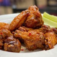 10 Piece Wings · Mild, medium, hot, honey barbecue, garlic, sweet chili served with bleu cheese or ranch dres...