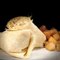 Morning Breakfast Burrito · Two eggs scrambled with onion, peppers, bacon, crispy potatoes and shredded cheese stuffed i...