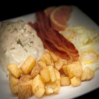 Biscuits And Gravy · Freshly baked biscuit topped with sausage gravy and served with two eggs cooked to order and...