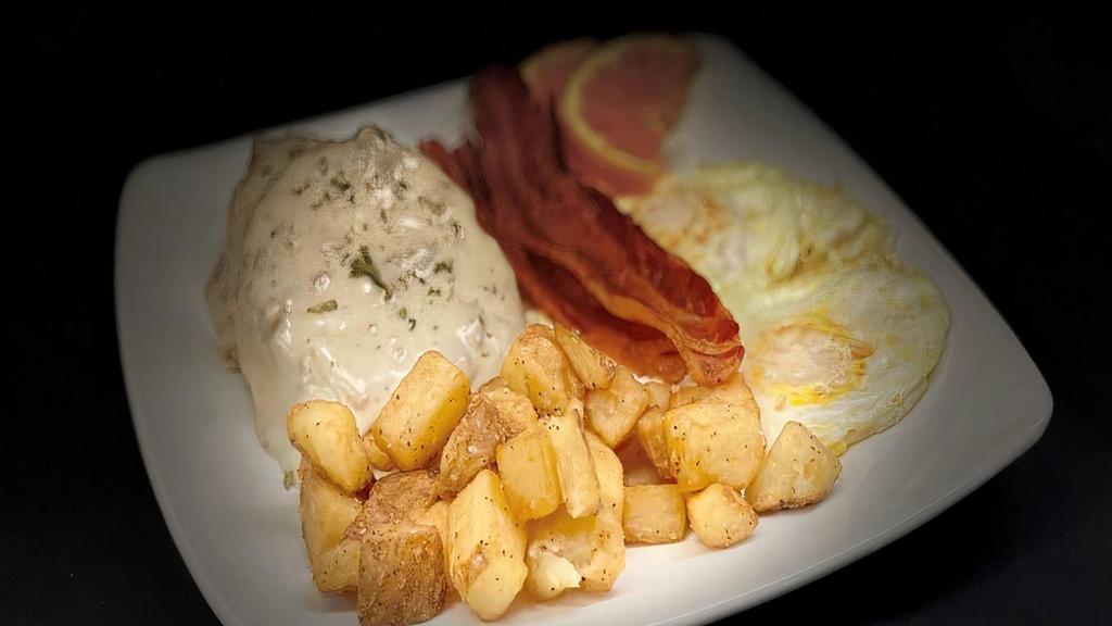 Biscuits And Gravy · Freshly baked biscuit topped with sausage gravy and served with two eggs cooked to order and choice of meat. 850 Calories