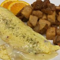 Tailor Made 3 Egg Omelet · Made with your choice of sausage, ham or bacon, Cheddar or Swiss cheese and peppers, onions,...
