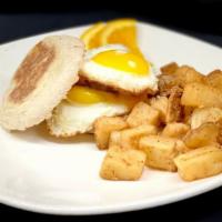 Sunrise Sandwich · Two eggs any style, Cheddar cheese and choice of meat on an English muffin, served with brea...