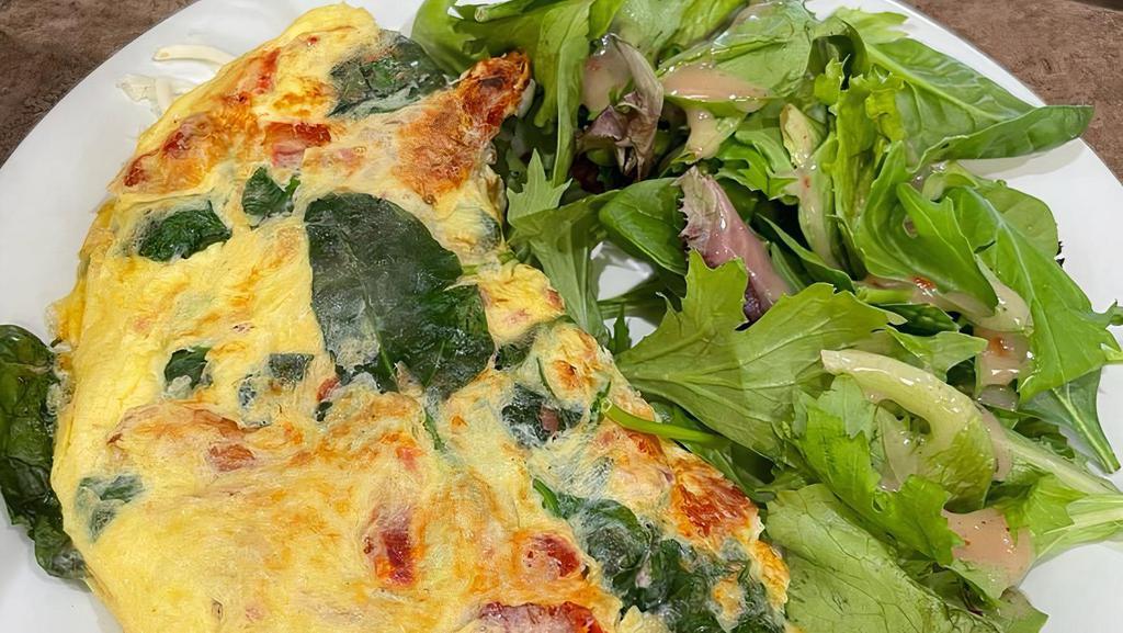 Create Your Own Omelette · Base charge egg only with side salad.