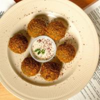 Falafel App · 6 pieces. Ground chickpeas with onion, parsley, garlic blended with special seasonings, and ...