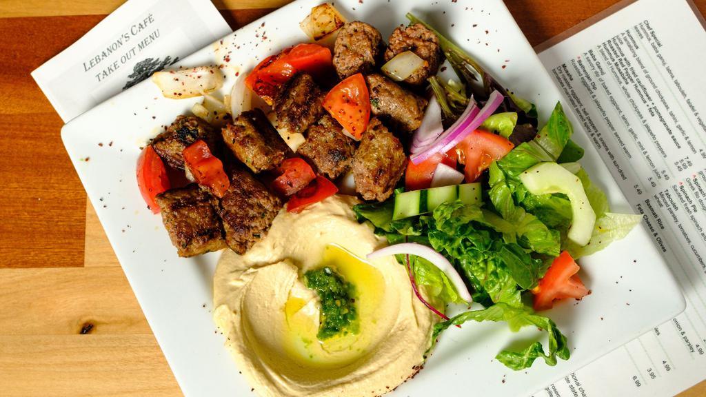 Lula Kabob Dinner · Fresh ground lamb and beef seasoned with parsley, onions, and Lebanese spices. Mixed with grilled onions and tomatoes.