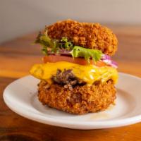 Mac Burger · Cheeseburger with two buns made of fried mac and cheese. Served with lettuce, tomato, red on...