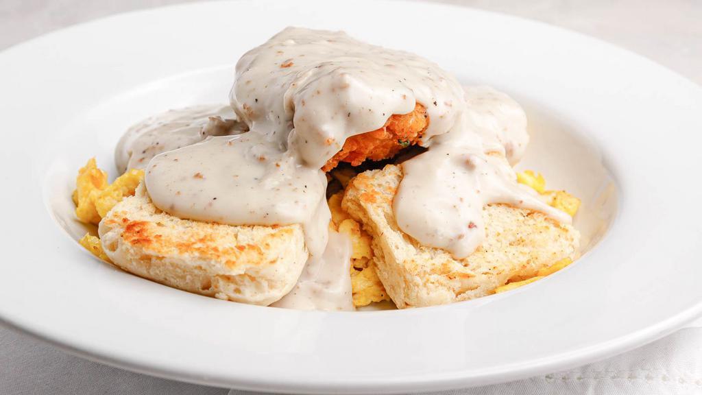 Aw Chicken & Biscuits · Chicken fried chicken over scrambled eggs and biscuits, covered with sausage gravy.