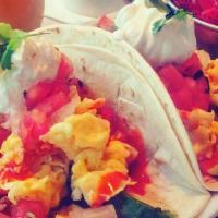 Breakfast Tacos · Two flour tortilla tacos filled with scrambled eggs, Cheddar cheese, avocado, and fresh made...