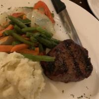 6Oz Petit Filet Mignon · Topped with Demi-Glace and served with bacon-wrapped asparagus and garlic-infused mashed pot...