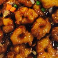 Mandarin Shrimp · Hot and spicy. Battered shrimp sautéed with onions, peas, carrots in spicy garlic sauce.
