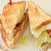 Club Sandwich · Ham, turkey, bacon, american cheese, lettuce, & tomato, mayo piled high in a triple decker s...