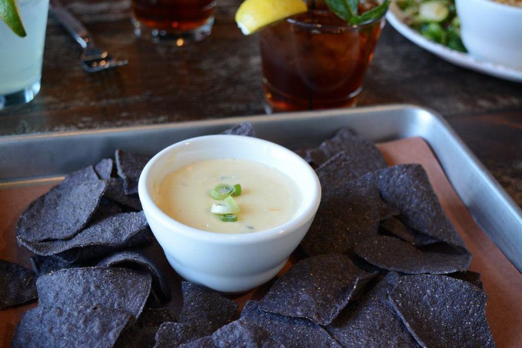 Smoked Queso · Served with gluten free blue corn tortilla chips.