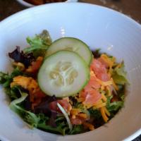 House Salad · Mixed greens, tomatoes, cucumbers and Cheddar.