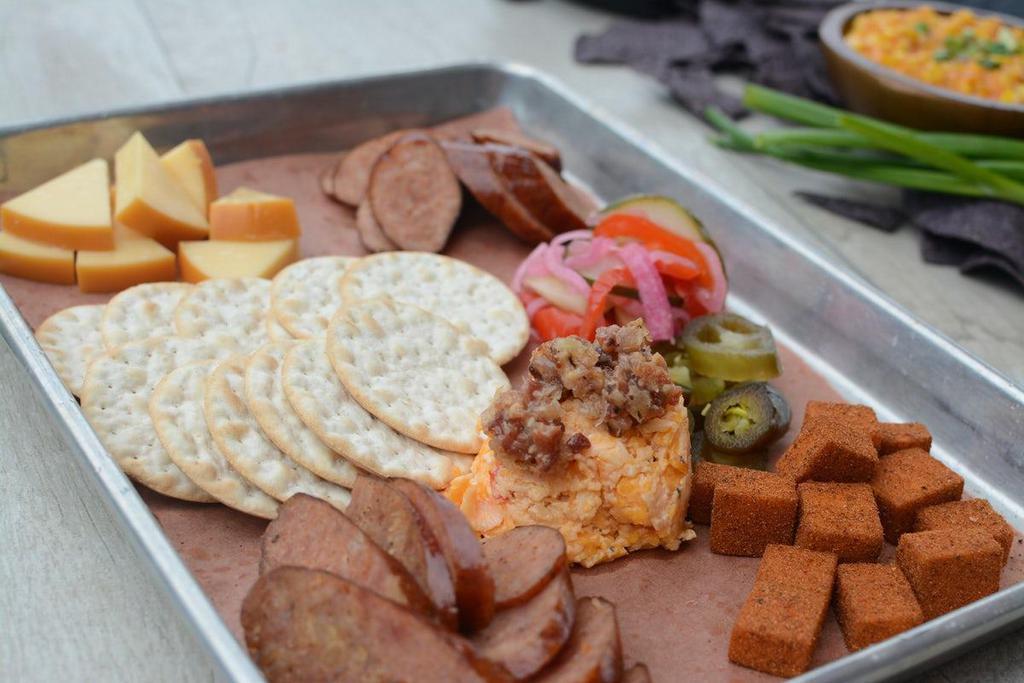 Sausage & Cheese Plate(Full) · Smoked Gouda, rub dusted Cheddar, Pimento cheese and Bacon jam, daily selection and traditional smoked sausage, pickled red onions and House pickles.