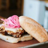 Sliced Brisket Sandwich · Sliced brisket with signature sauce topped with melted Provolone cheese, pickled onions serv...