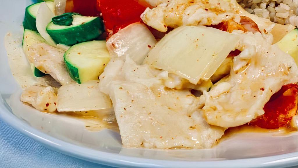 Spicy Thai Red Curry Chicken · Chicken with red pepper, onion, zucchini and coconut milk in spicy curry sauce. Substitute fried tofu for chicken without additional cost.