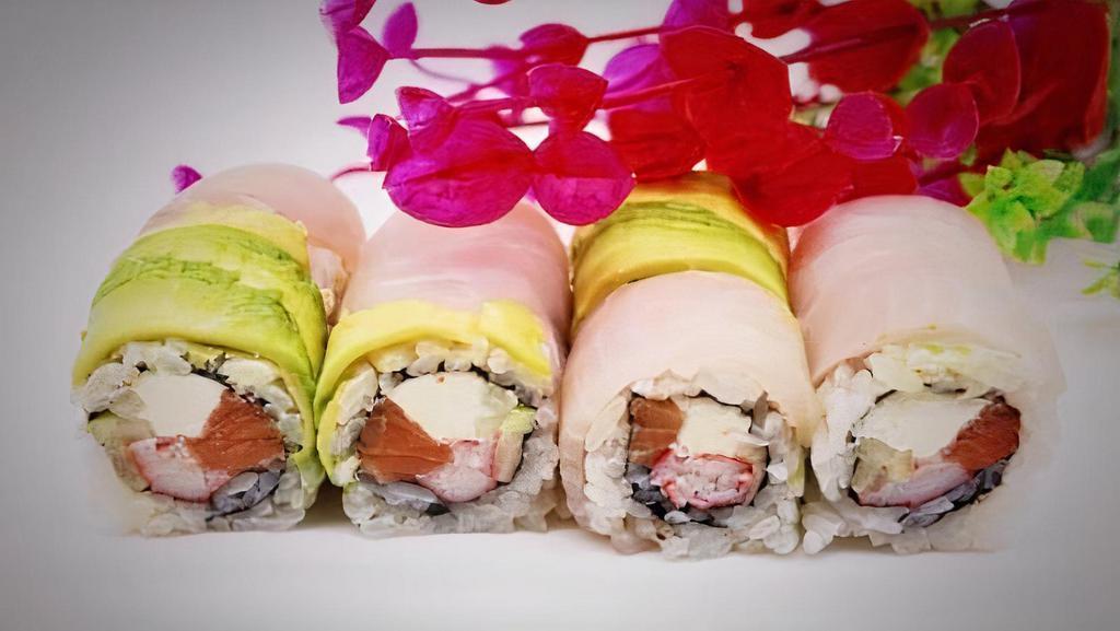 Philly Deluxe Roll · 8 pieces. Raw. Smoked salmon, cheese, crab and cucumber, white fish, avocado, spicy mayo and wasabi mayo.