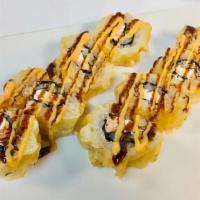 Wolfpack Roll · 8 pieces. Fried roll. Raw. Salmon and cream cheese, lightly fried, with spicy mayo and eel s...