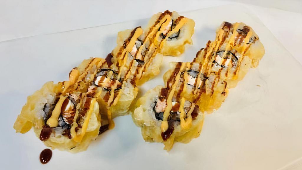 Wolfpack Roll · Eight pieces. Fried roll. Raw. Salmon and cream cheese, lightly fried, with spicy mayo and eel sauce.