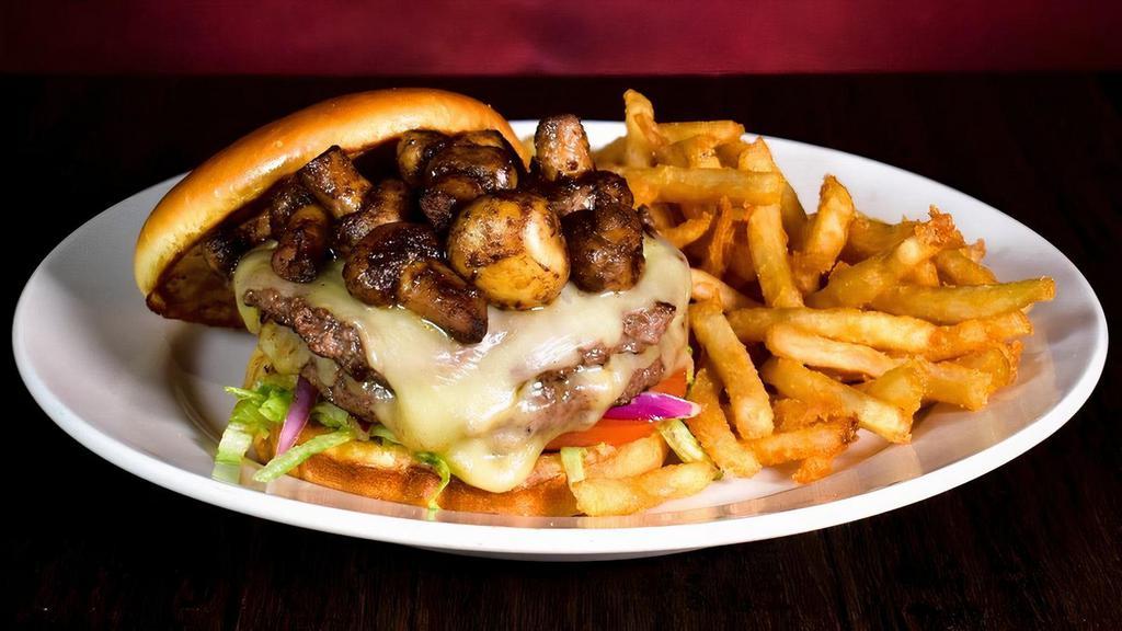 Mushroom Jack Burger · Two quarter pound beef patties with sautéed mushrooms, jack cheese. Served with french fries.