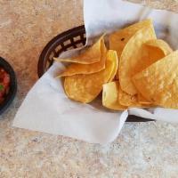 Chips & Dip · Seasoned tortilla chips with fresh salsa or mango salsa upon request.