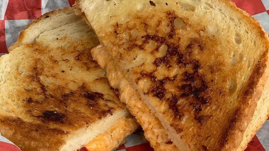 Grilled Pimento Cheese · House-made pimento cheese with toasted sourdough bread