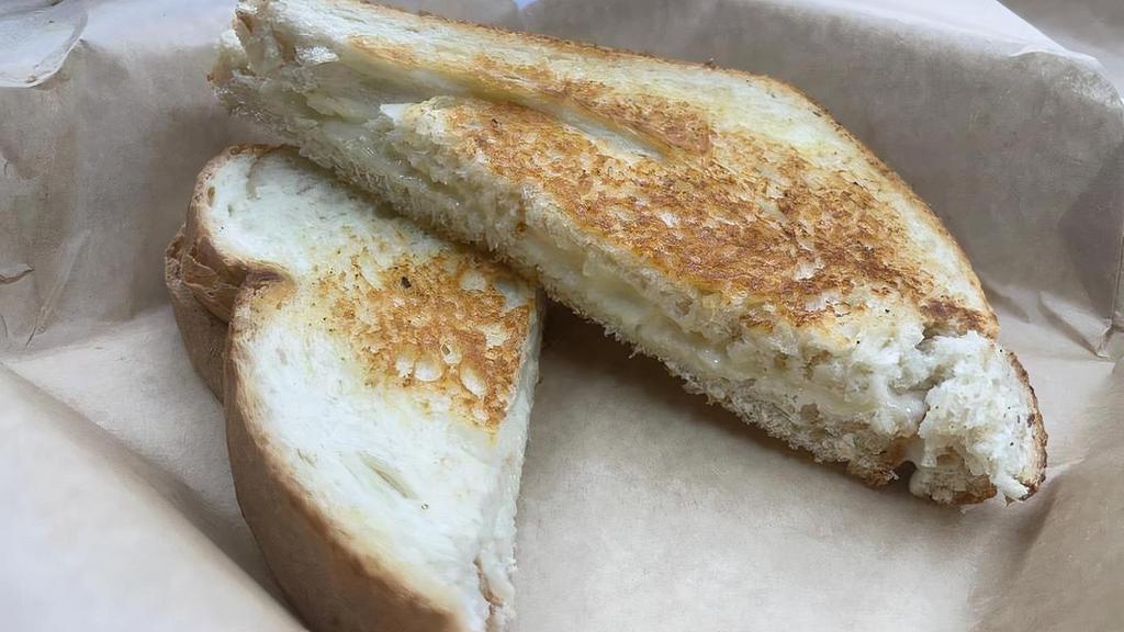 Classic Grilled Cheese · American white cheese served on toasted sourdough bread
