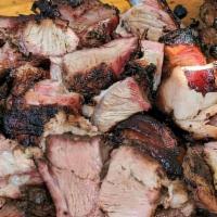 Jerk Pork · Smoked and authentic flavored to the bone Jamaican style Jerk Pork. Served with your choice ...
