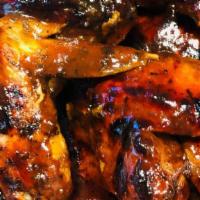 Jerk Bbq Wings · Smoked and authentic flavored to the bone Jamaican style Jerk wings smothered in BBQ sauce. ...