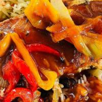 Jerk Bbq Salmon · Baked salmon smothered in smoked jerk BBQ sauce. served with choice of rice & peas/ white ri...