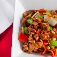 Kung Pao Chicken · Hot & spicy. Chicken diced and sauteed in rich brown sauce w. Red peppers & peanuts.