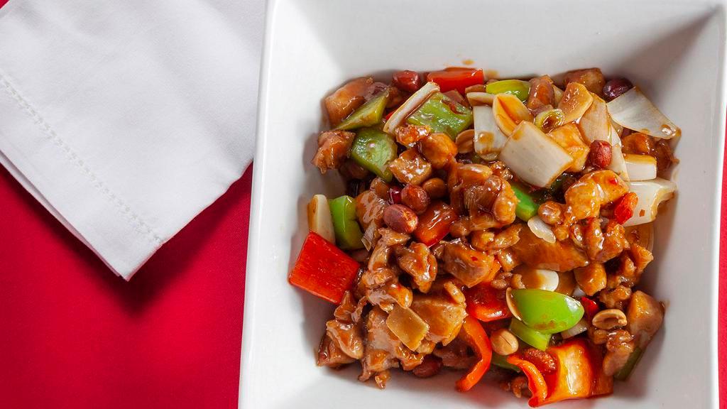 Kung Pao Chicken · Hot & spicy. Chicken diced and sauteed in rich brown sauce w. Red peppers & peanuts.