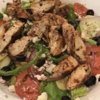 Greek Salad · Fresh crisp lettuce, onions, tomatoes, green peppers, black olives, Feta cheese and oregano.
