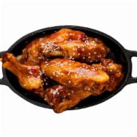 Chicken Wings · Classic bone in wings oven baked cooked to order perfectly crisp tossed with your choice of ...