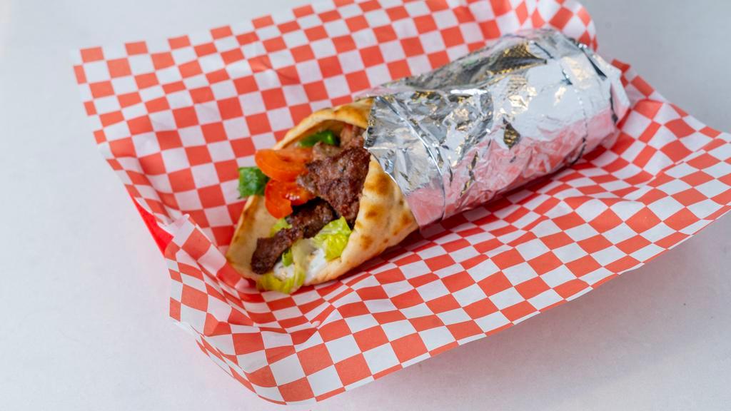 Gyro · Mixed beef and lamb, tzatziki sauce, lettuce, and tomato.
