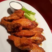 Buffalo Wings (12) · Jumbo wings tossed in our homemade buffalo, extra spicy habanero, or tangy Thai barbecue sau...