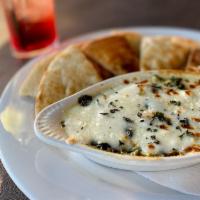 Spinach & Artichoke Dip · Fresh spinach & creamy cheeses blended with artichoke hearts served warm with herb brushed p...