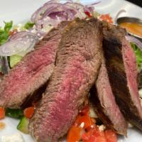 Steak & Feta Salad · Spring mix topped with red onion, feta, cucumber, tomato & grilled tenderloin with our Blood...