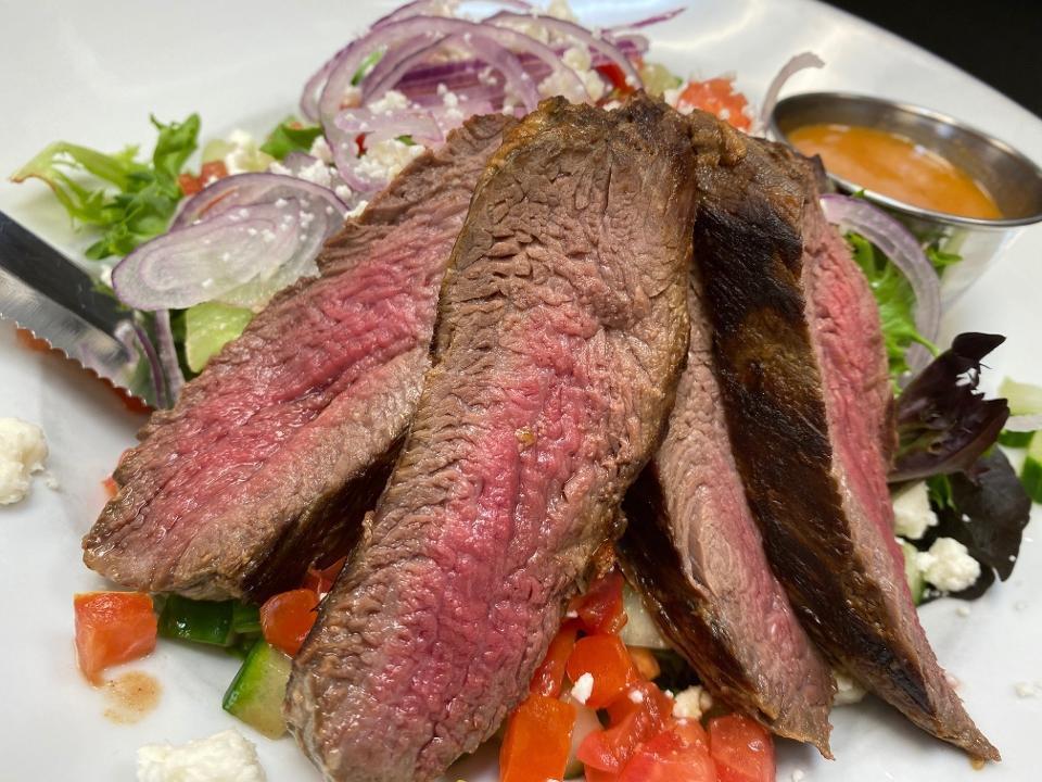 Steak & Feta Salad · Spring mix topped with red onion, feta, cucumber, tomato & grilled tenderloin with our Bloody Mary vinaigrette.