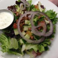 Field Of Greens · Spring mix with red onion, pralines, cucumber & tomato. Served with your choice of dressing.