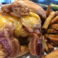 Whiskey Burger · An all prime beef patty topped with double cheddar cheese, three slices of bacon & whiskey c...