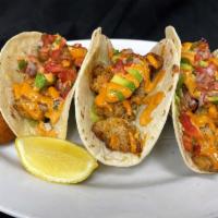 Galway Bay Fish Tacos · Blackened whitefish, avocado, pico de gallo & lettuce served in flour tortillas with our tan...