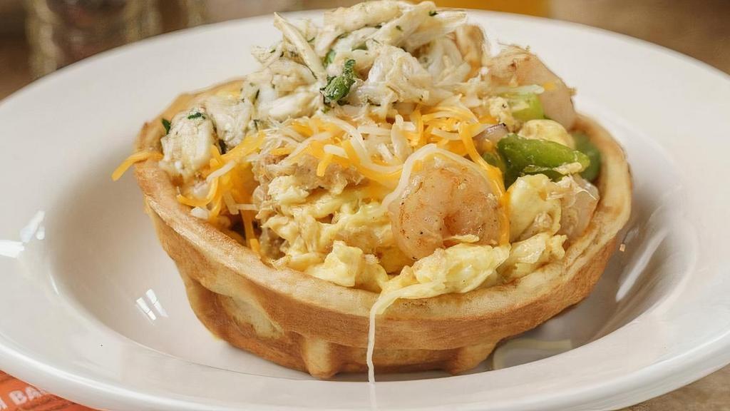 Breakfast Waffle Bowl · Waffle bowl filled with scrambled eggs, onions, bell peppers, and your choice of bacon sausage, ham, turkey or no meat. Topped with a shredded cheese blend. Customize it even more by adding extra meats or veggies.