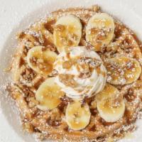 Banana Nut Waffle · Banana nut Belgian waffle topped with confectioners’ sugar, bananas, whipped cream and a car...