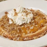 It'S Peachy Waffle · Belgian waffle topped with warm peaches, whipped cream, granola and confectioners’ sugar.