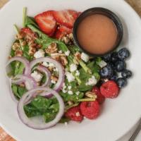 Twisted Spinach & Berries Salad · Baby Spinach, red onions, pecans, goat cheese and a variety of berries with raspberry vinaig...