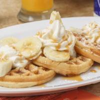 Crazy Bananas Waffle · Belgian waffle topped with confectioners’ sugar and bananas, drizzled in caramel.