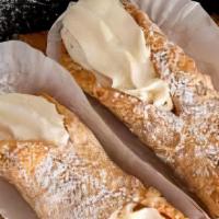Cannoli  · Italian pastry shell filled with sweetened ricotta cheese and chocolate bits.
