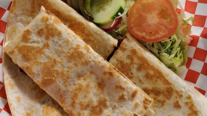 Quesadilla · Cooked flour tortilla that is served with any choice of meat, filled with cheese and folded in half.